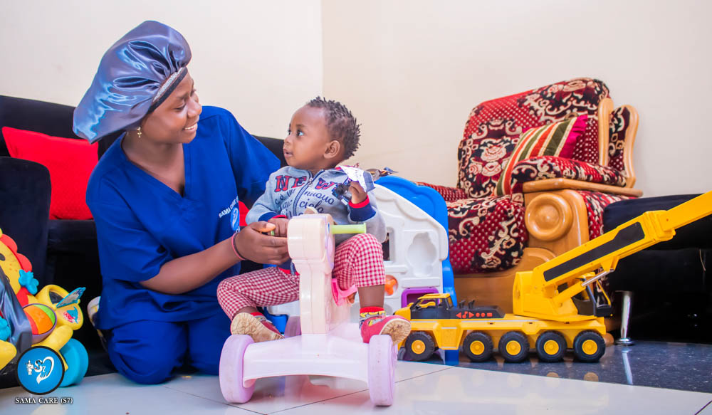 Warm elderly woman with professional caregiver smiling together at home